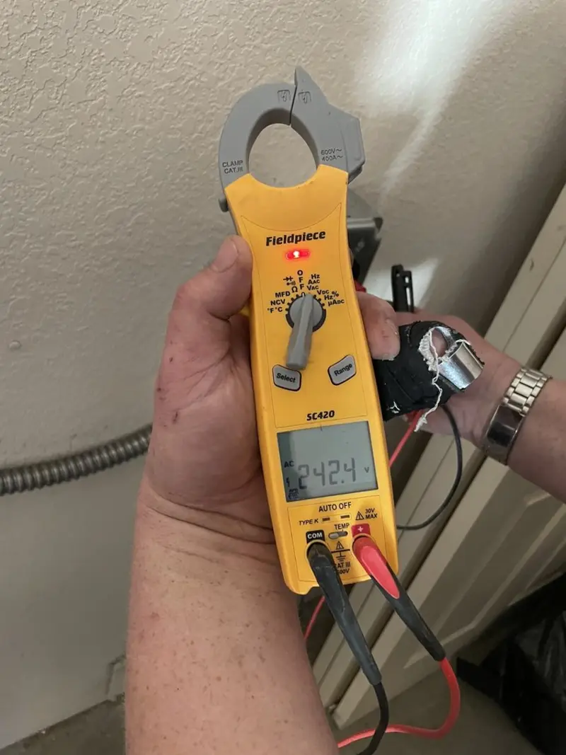 Voltage testing with clamp meter during Whole House Surge Protector in Chamblee